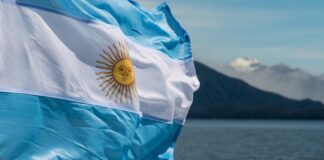 Argentina flag with mountains in background