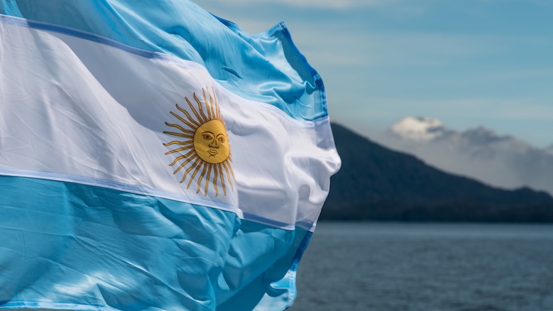 Argentina flag with mountains in background